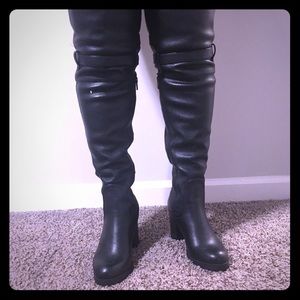 Knee high black boots never been worn.